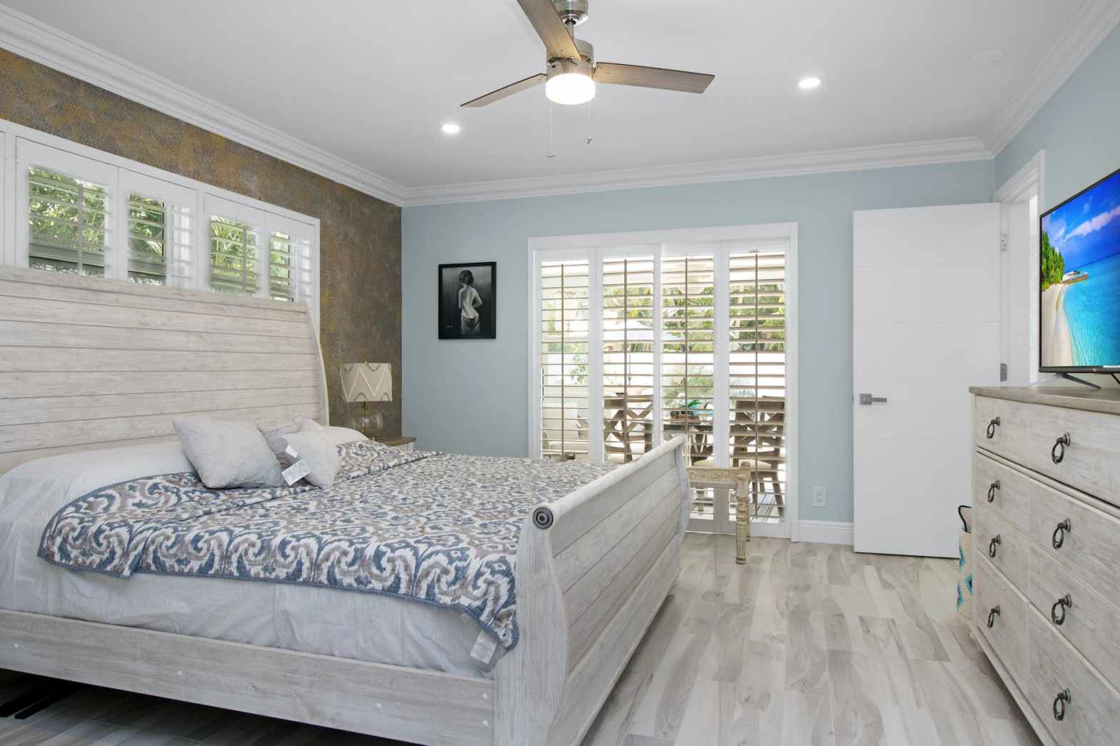 a bedroom with wooden bed
