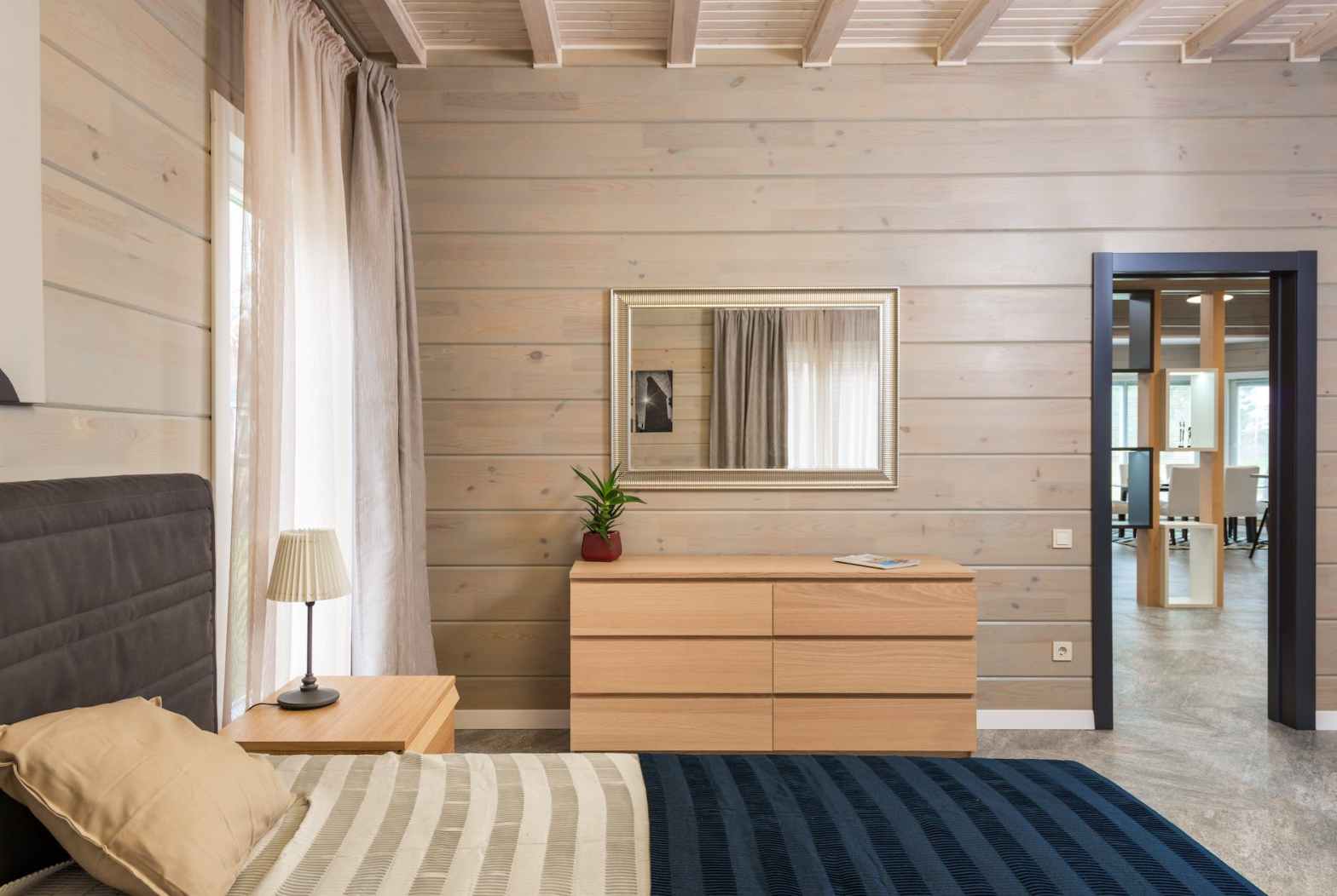 bed in modern bedroom with furniture